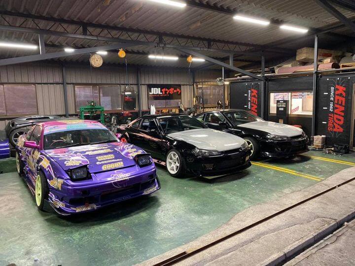 Japanese sports cars parked in JDL Imports' workshop