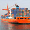 Shipping vessel with containers docked at a port